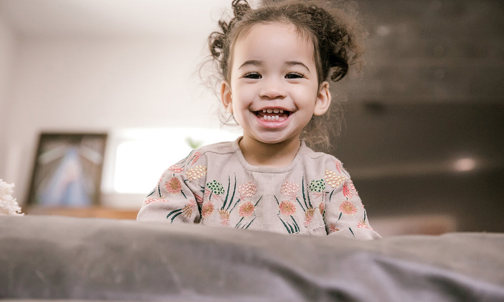young girl looking and smiling