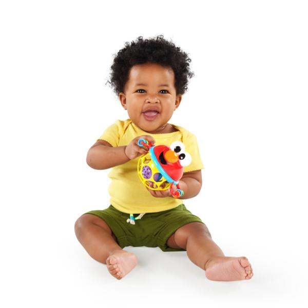 child holding elmo ball