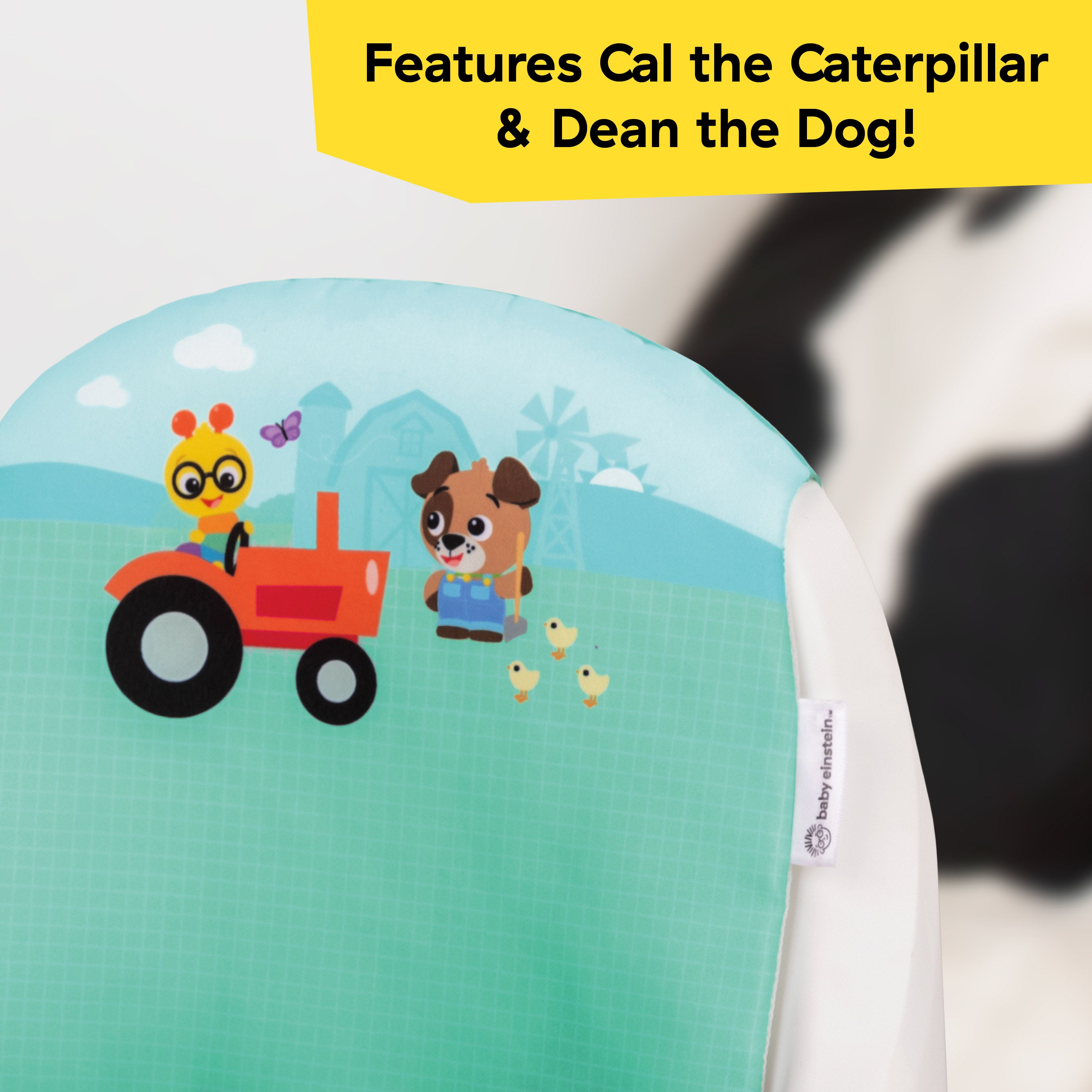 Close-up of farm-themed padded backrest on feeding seat
