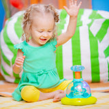 Bright Starts Press & Glow Spinner Cause and Effect Musical Baby Toy