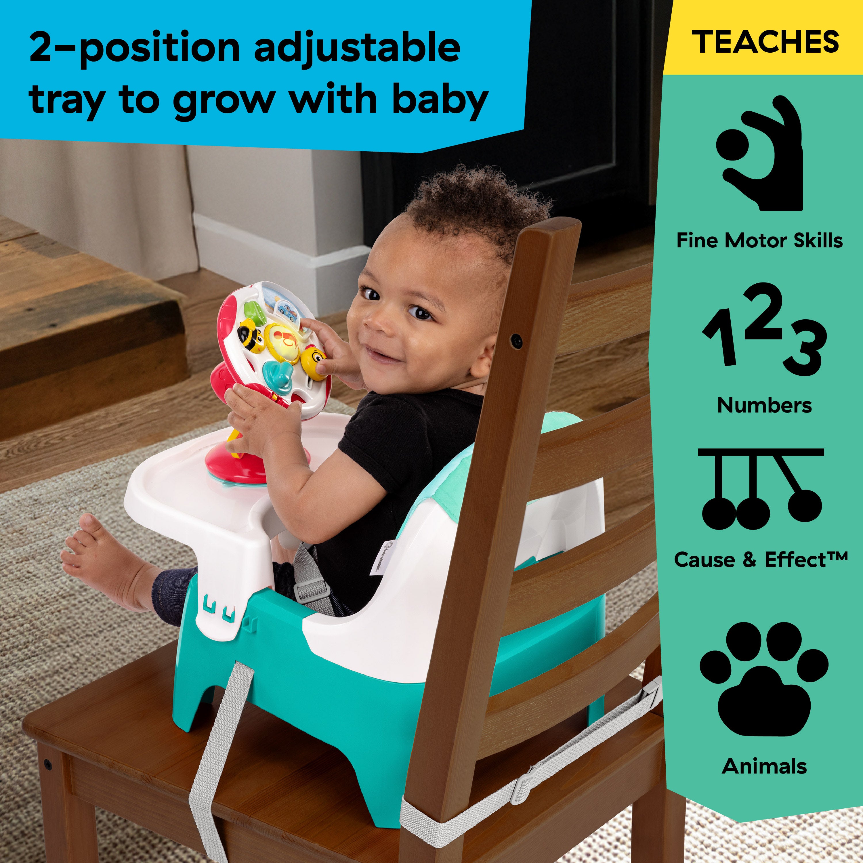 Baby in elevated dining seat with attached tray