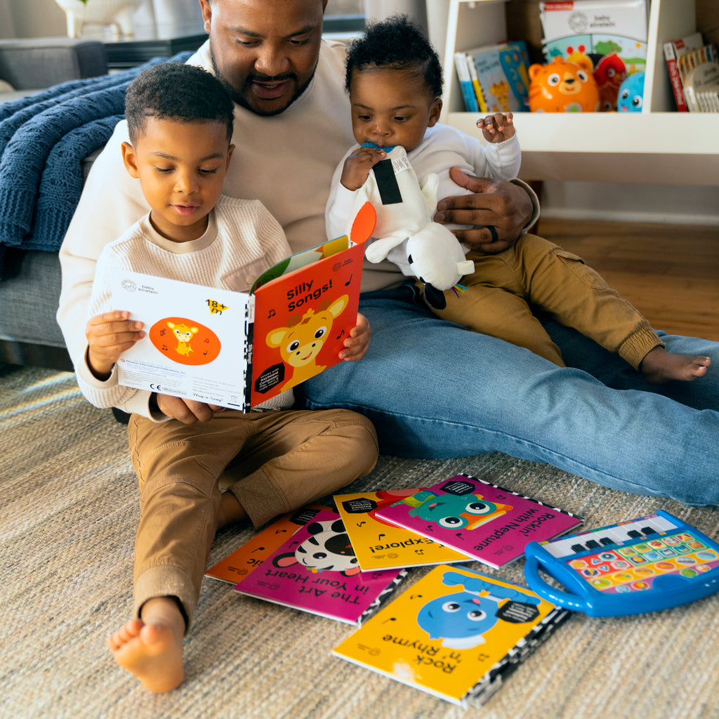 dad with two young boys reading