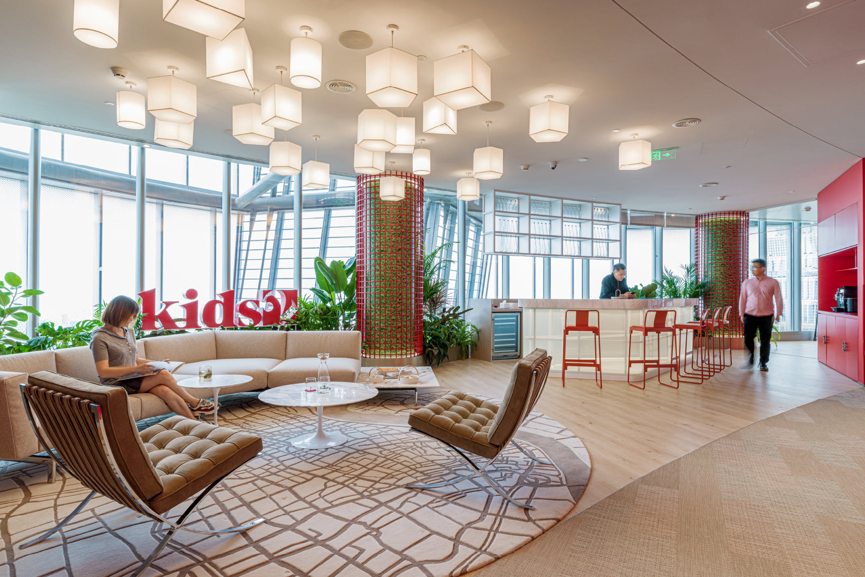 office with open floor plan high top and table with chairs