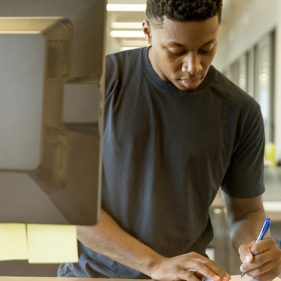 man working at a stand up desk